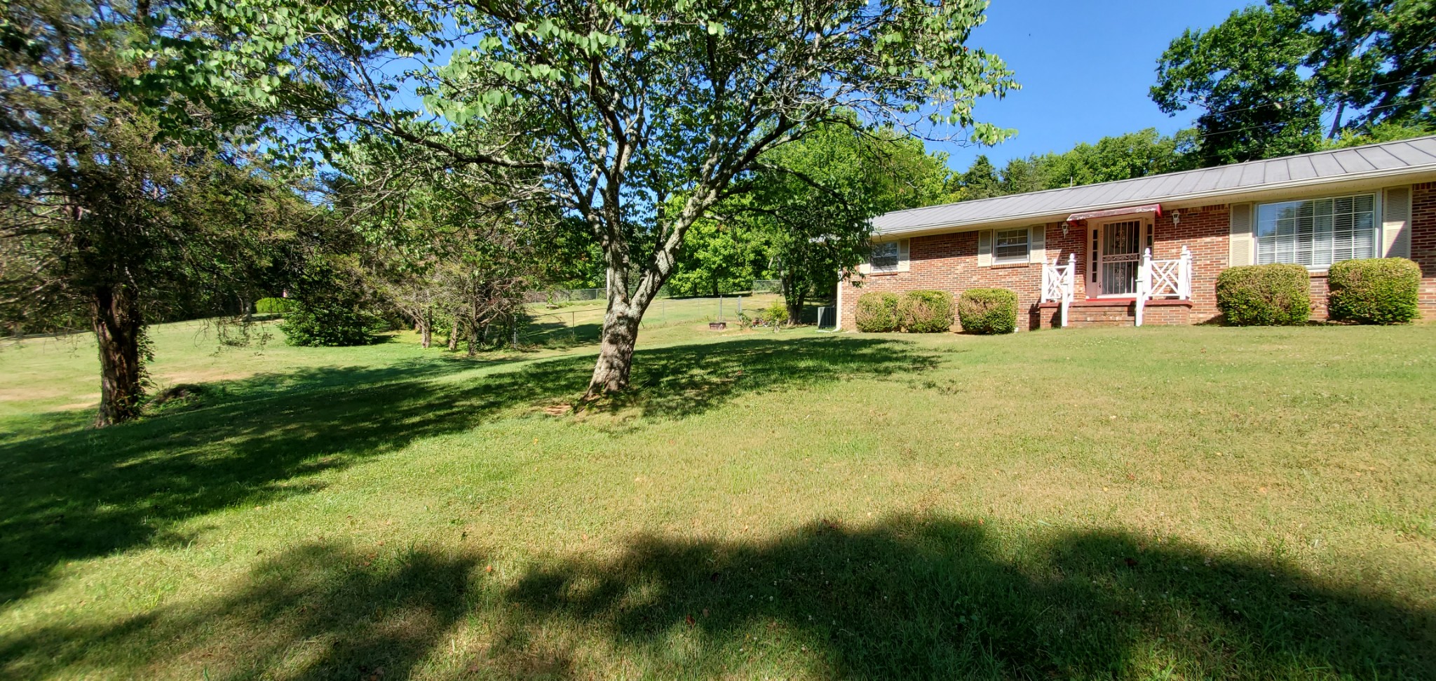 1915 Crescentview Road Pulaski, TN 38478 - Photo 22 of 28 a view of a house with a big yard and large trees