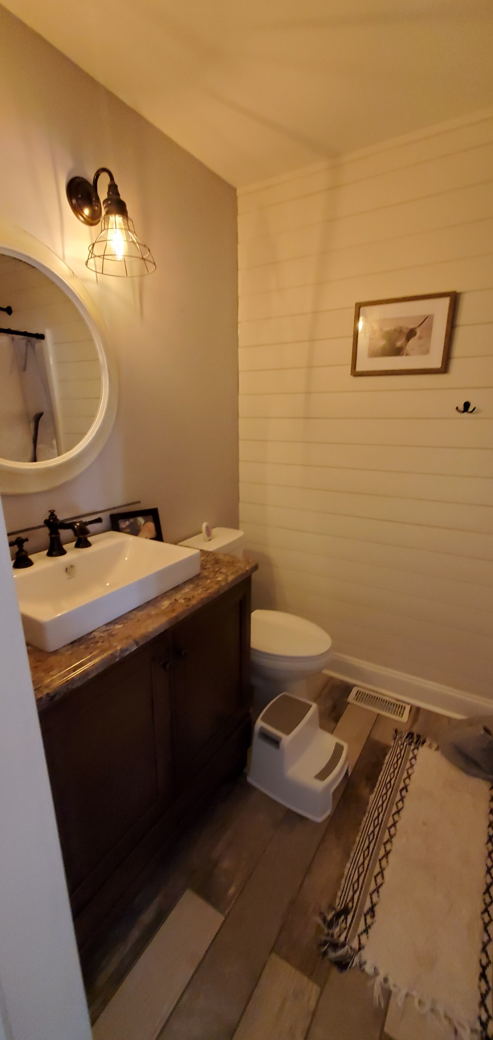 1915 Crescentview Road Pulaski, TN 38478 - Photo 28 of 28 a bathroom with a sink a toilet and mirror
