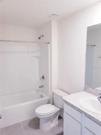 a bathroom with a sink a toilet and a bathtub