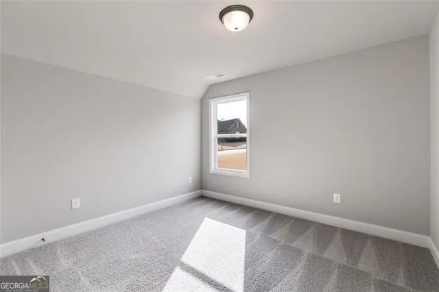 an empty room with a empty space and window