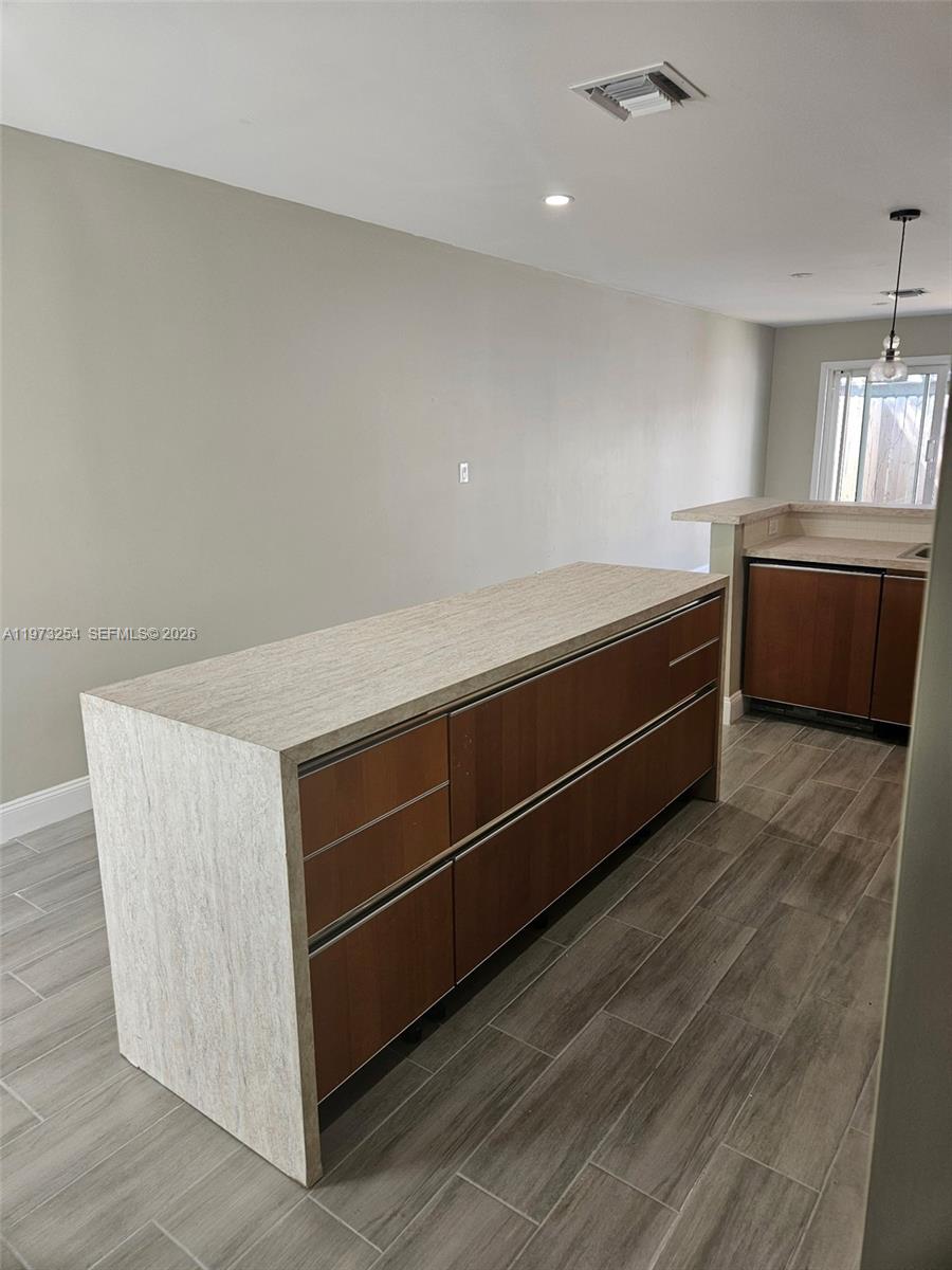 3906 Northwest 207 St Road, Unit 3906 Miami Gardens, FL 33055 - Photo 15 of 26 a view of room with window and wooden floor