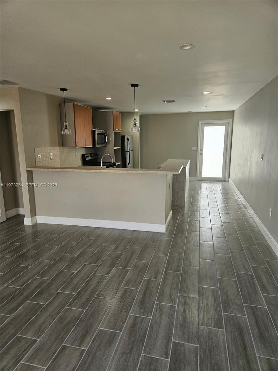 3906 Northwest 207 St Road, Unit 3906 Miami Gardens, FL 33055 - Photo 21 of 26 a view of empty room with wooden floor