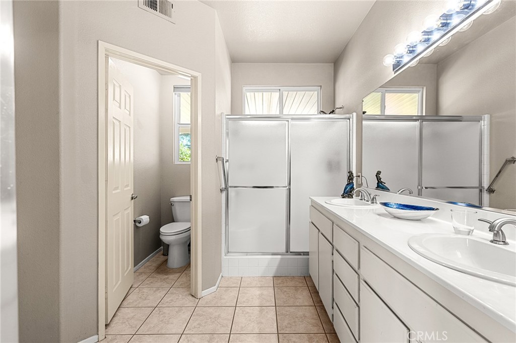 1318 South Bay Hill Road Banning, CA 92220 - Photo 20 of 53 Primary Bathroom has Walk-in Shower and Privacy Door to Commode