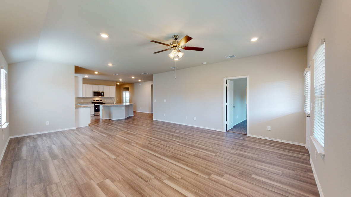 509 Hector Loop Georgetown, TX 78626 - Photo 30 of 31 An open floorplan seamlessly connects the living area with a well-appointed kitchen.