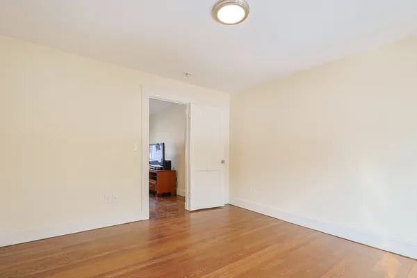 a view of a livingroom and wooden floor