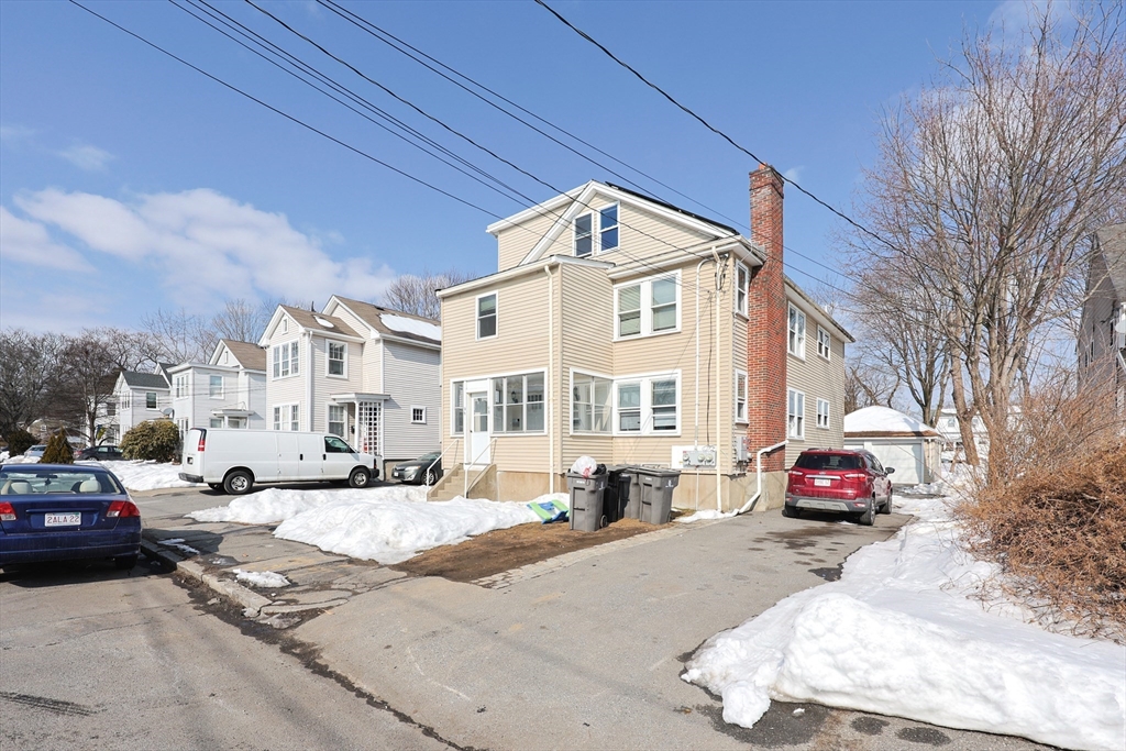 96 Mansfield Street Framingham, MA 01702 - Photo 2 of 39 a cars parked on the side of a street