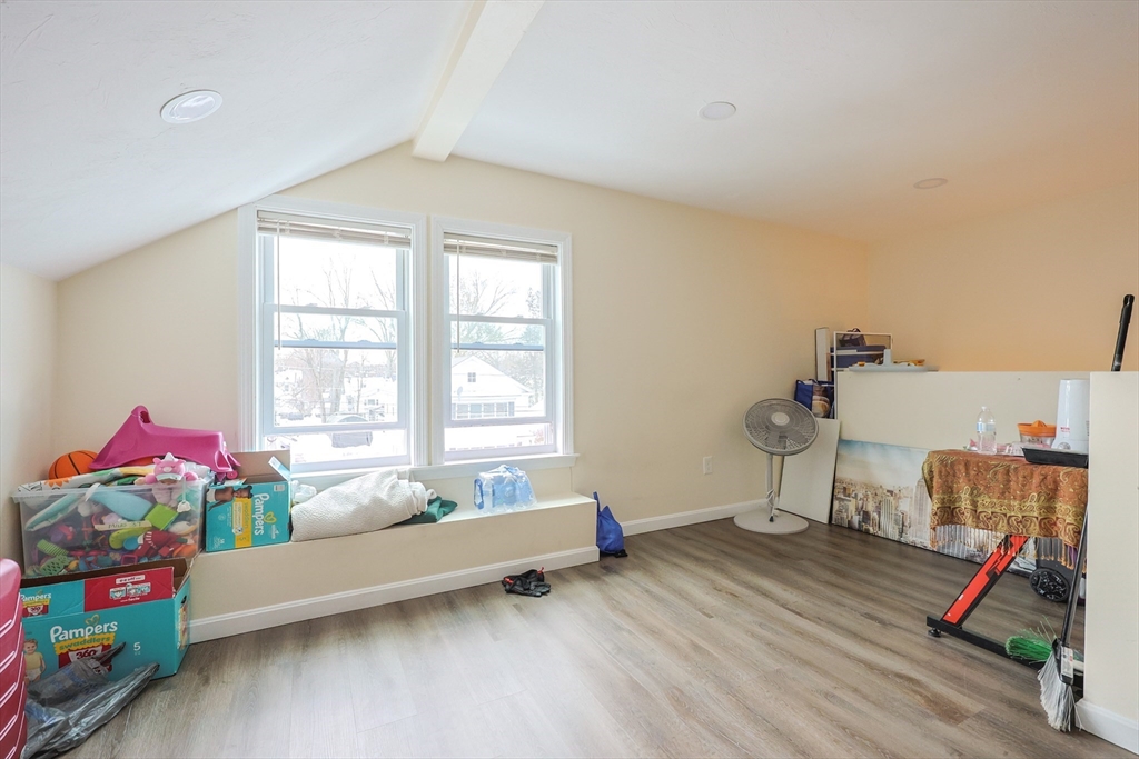 96 Mansfield Street Framingham, MA 01702 - Photo 29 of 39 a living room with furniture and a wooden floor