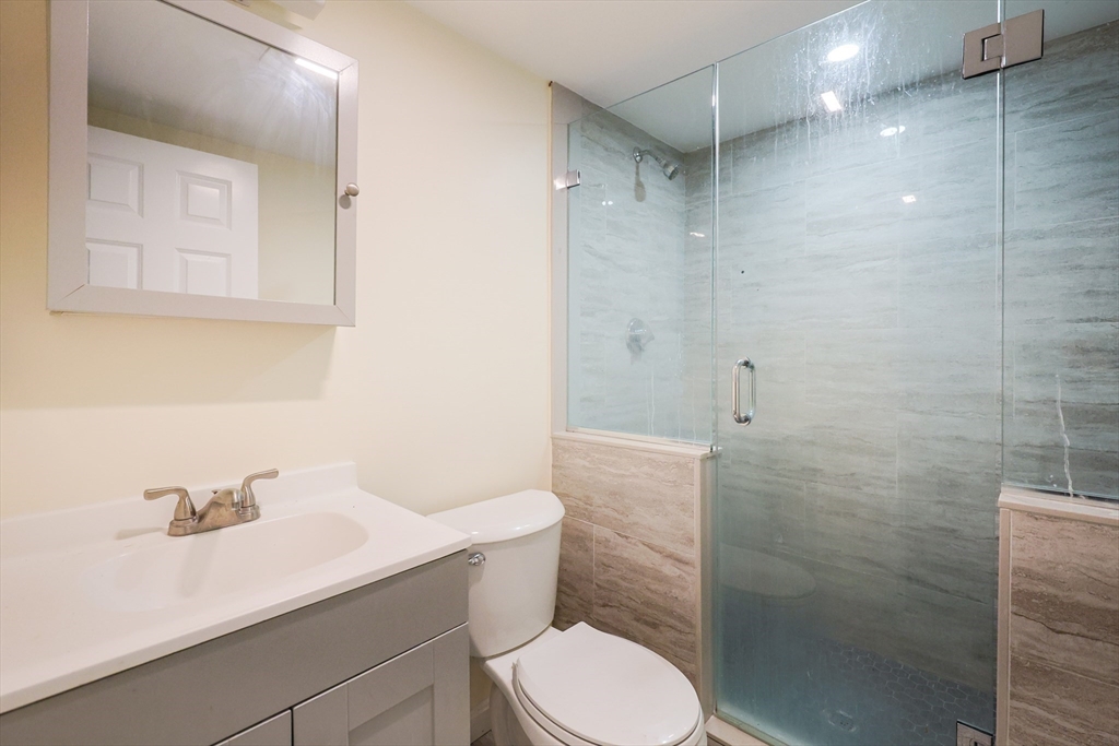 96 Mansfield Street Framingham, MA 01702 - Photo 31 of 39 a bathroom with a sink toilet and shower