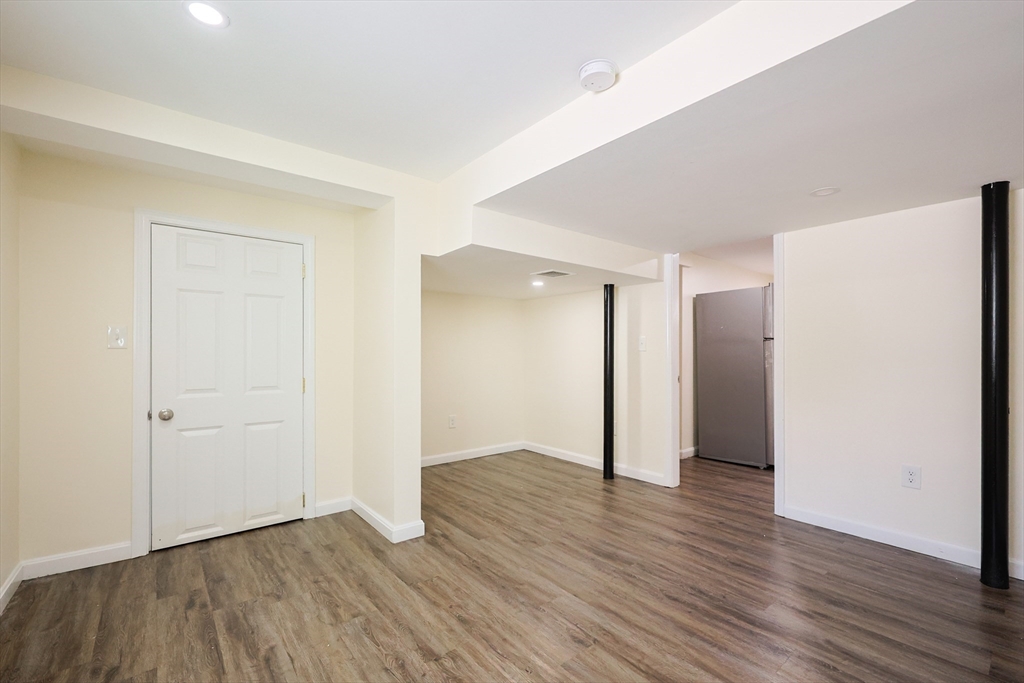 96 Mansfield Street Framingham, MA 01702 - Photo 34 of 39 an empty room with wooden floor & closet area