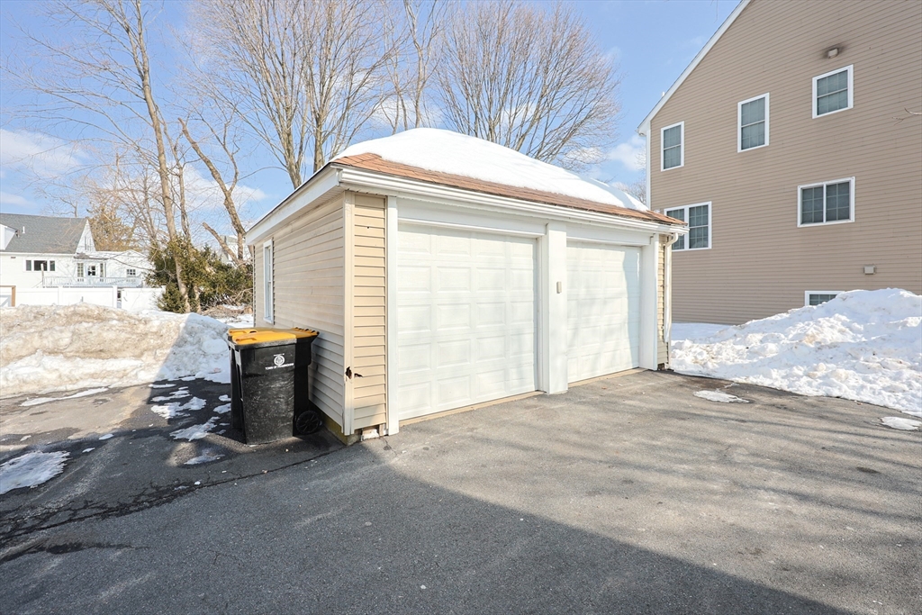 96 Mansfield Street Framingham, MA 01702 - Photo 35 of 39 a view of a house with a snow