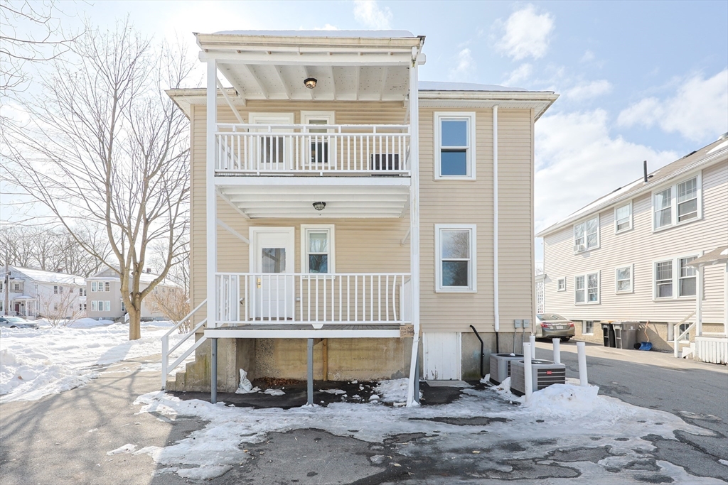 96 Mansfield Street Framingham, MA 01702 - Photo 37 of 39 a front view of a house with a yard