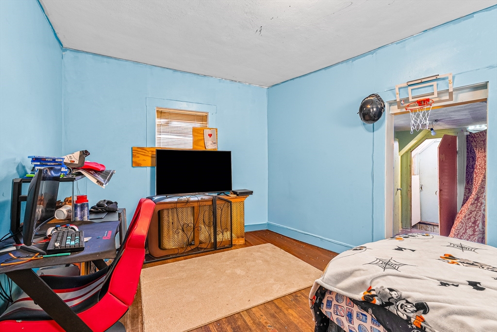 187 St Mary Street Needham, MA 02494 - Photo 16 of 28 a bedroom with a bed and a flat screen tv