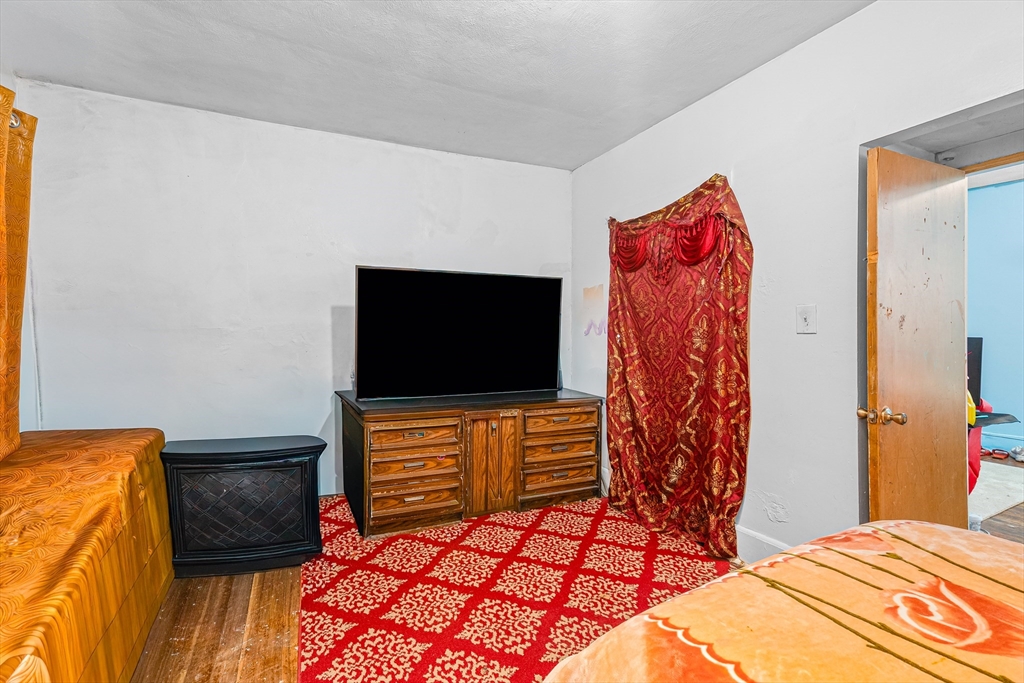 187 St Mary Street Needham, MA 02494 - Photo 19 of 28 a bedroom with a bed and a television