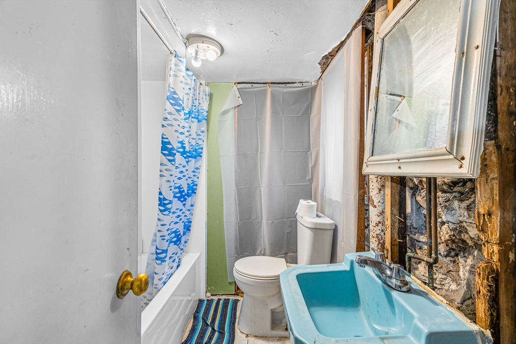 187 St Mary Street Needham, MA 02494 - Photo 25 of 28 a bathroom with a sink toilet and shower