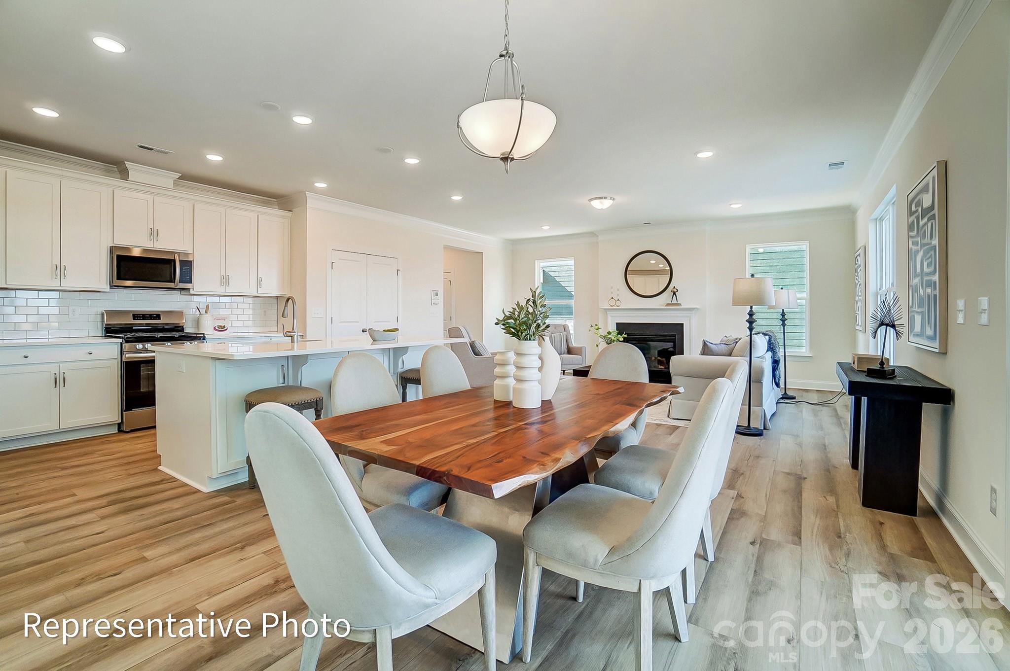 13127 Foxberry Road Charlotte, NC 28213 - Photo 11 of 24 a large kitchen with cabinets table and chairs