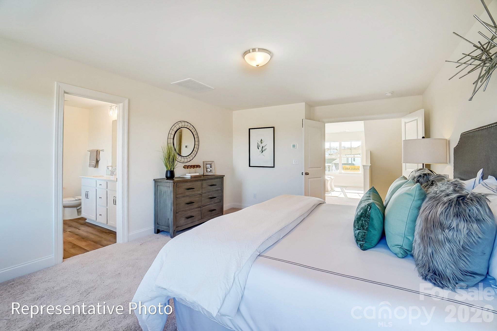13127 Foxberry Road Charlotte, NC 28213 - Photo 16 of 24 a bedroom with a bed and a dresser