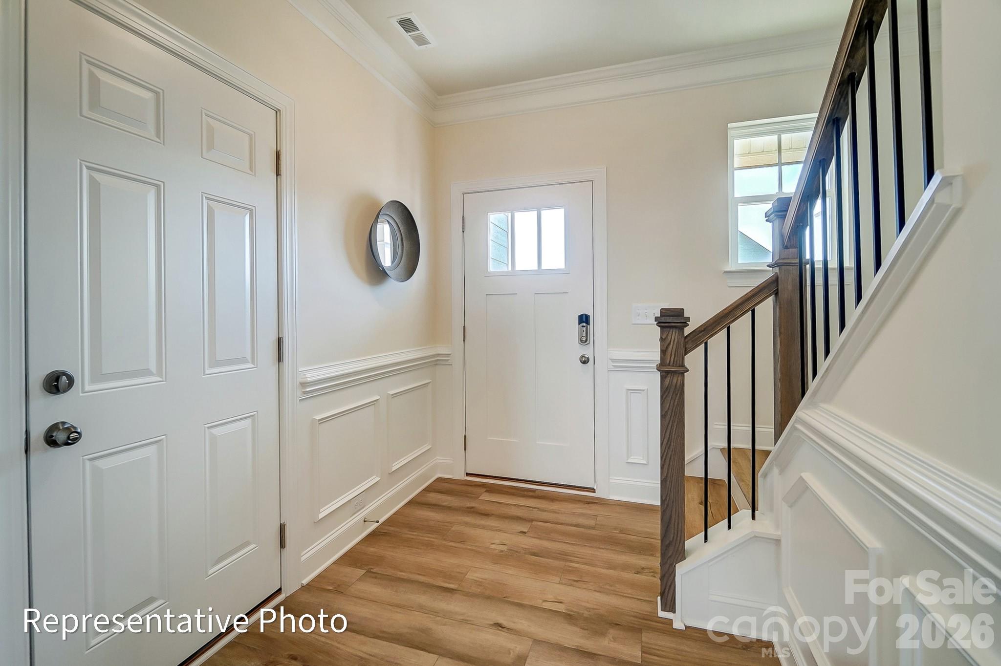 13127 Foxberry Road Charlotte, NC 28213 - Photo 2 of 24 a view of an entryway with wooden floor