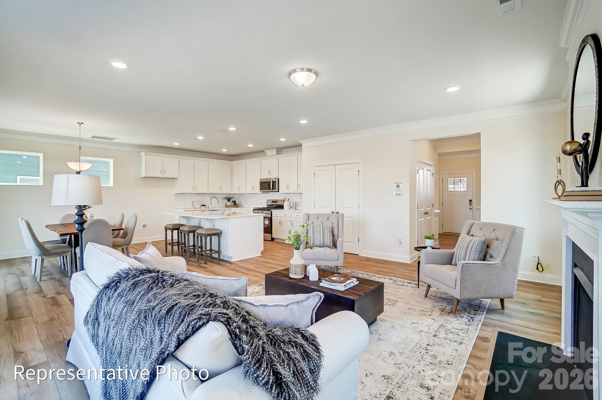 13127 Foxberry Road Charlotte, NC 28213 - Photo 4 of 24 a living room with furniture and a view of kitchen