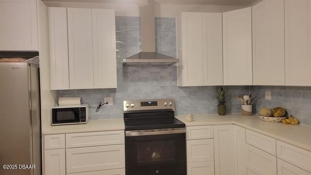 602 Temko Terrace Daytona Beach, FL 32118 - Photo 11 of 20 a kitchen with stainless steel appliances white cabinets and a stove
