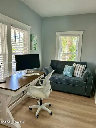 a living room with furniture and a window