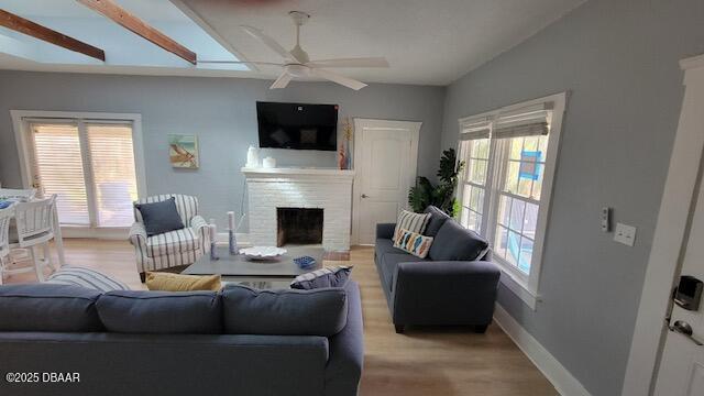 602 Temko Terrace Daytona Beach, FL 32118 - Photo 7 of 20 a living room with furniture a fireplace and a flat screen tv