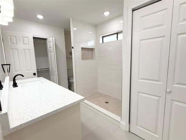a bathroom with a bathtub and a sink
