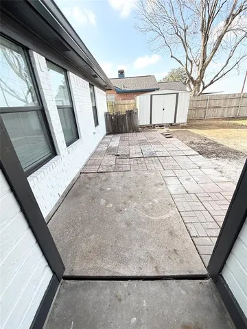 a view of a backyard of a house