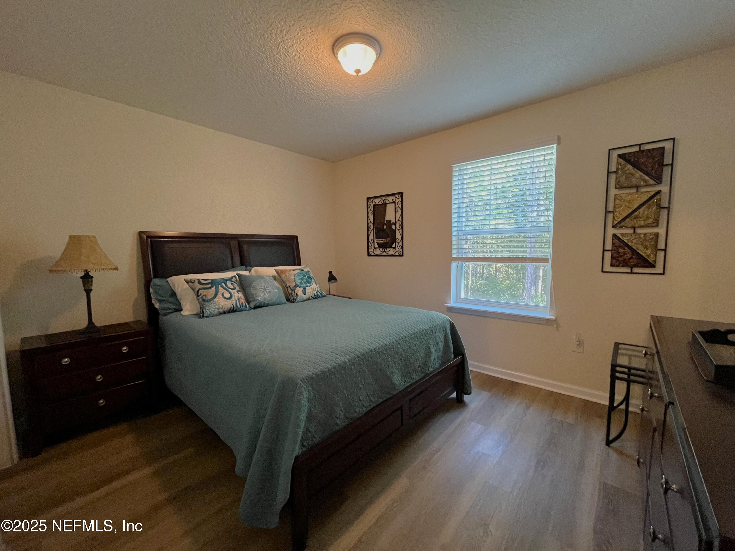 2103 Golden Lake Loop, Unit 2103 St. Augustine, FL 32084 - Photo 15 of 32 a bedroom with a bed and a window