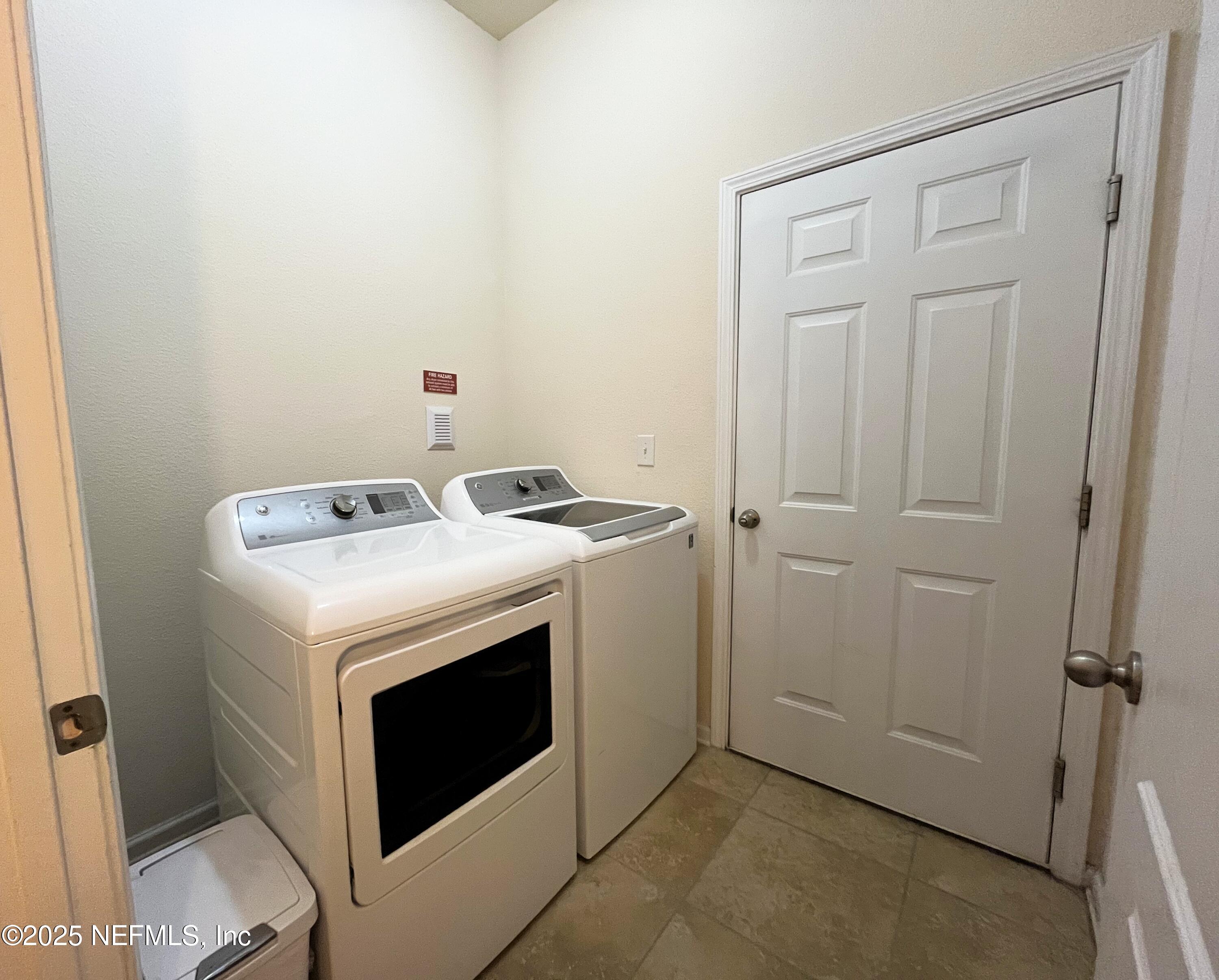 2103 Golden Lake Loop, Unit 2103 St. Augustine, FL 32084 - Photo 21 of 32 a utility room with dryer and washer
