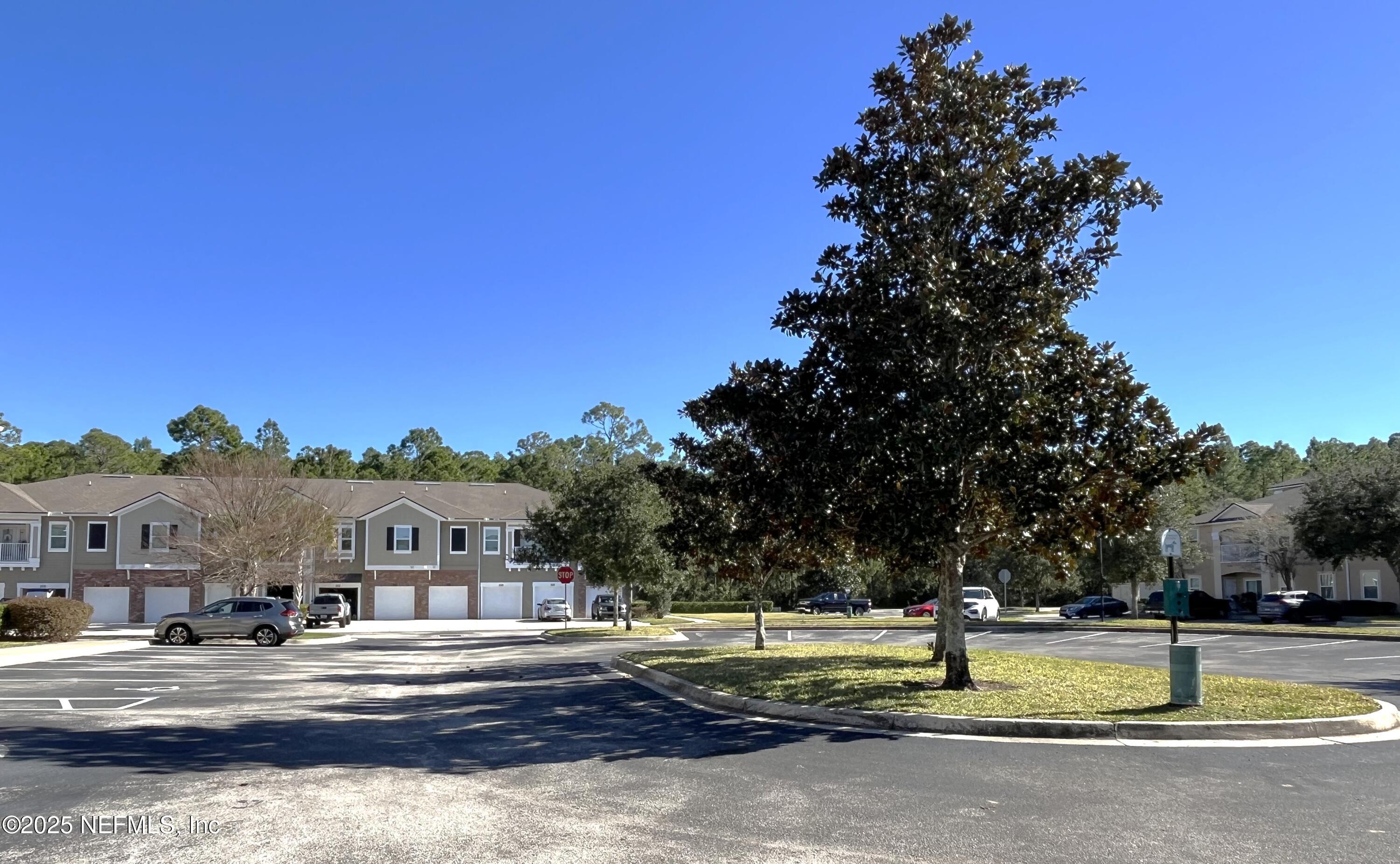 2103 Golden Lake Loop, Unit 2103 St. Augustine, FL 32084 - Photo 31 of 32 a view of swimming pool and trees in the background