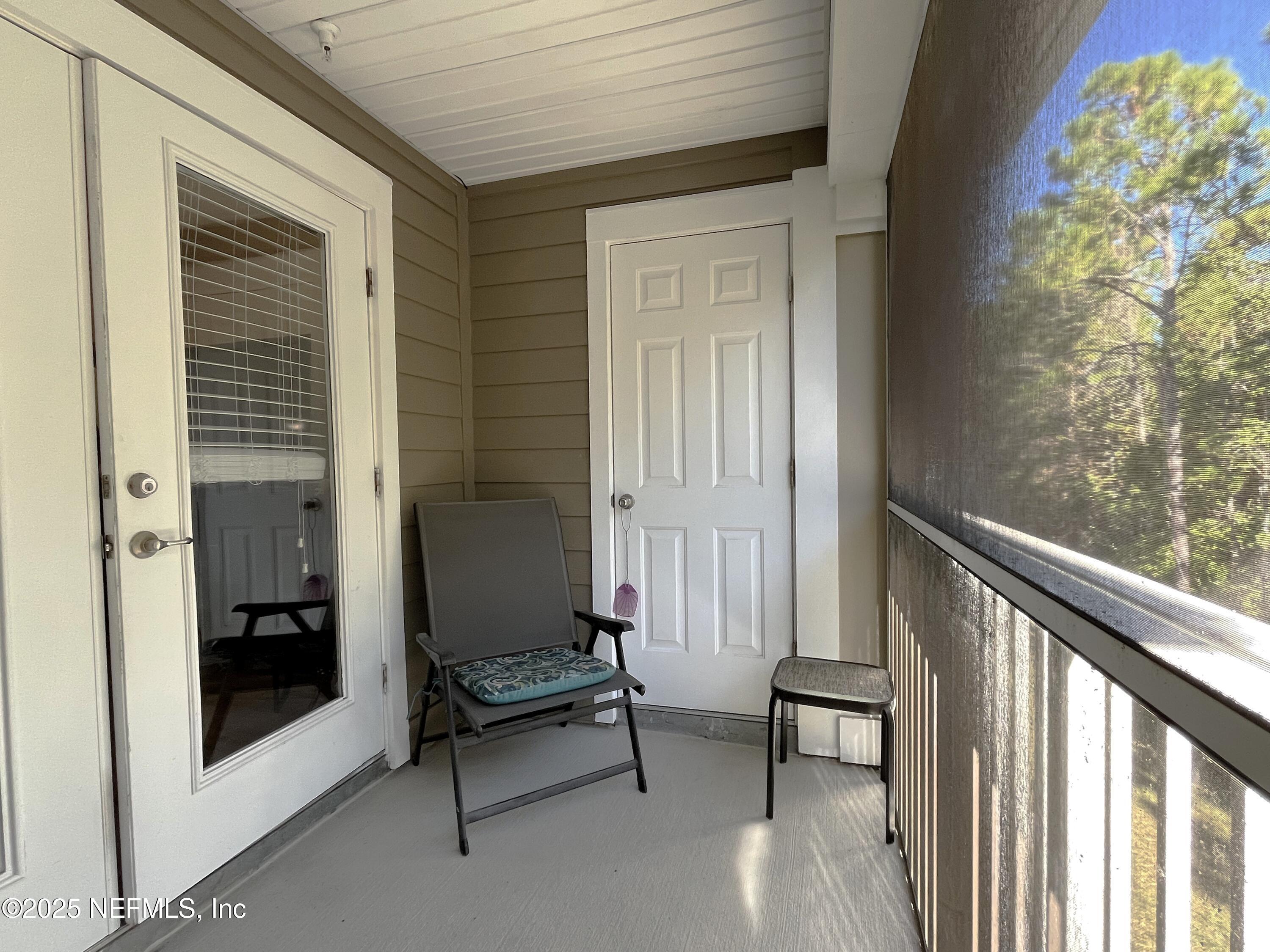 2103 Golden Lake Loop, Unit 2103 St. Augustine, FL 32084 - Photo 10 of 32 a view of outdoor space with sliding door and wooden floor