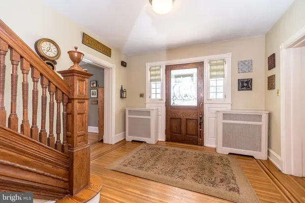 a kitchen with stainless steel appliances granite countertop a stove a sink dishwasher and cabinets with wooden floor