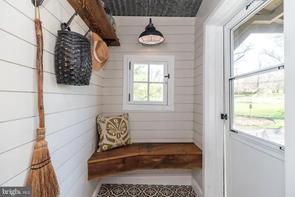 a view of a bedroom with furniture and windows