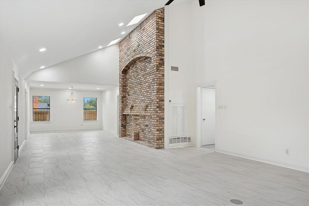 62 Legend Road Benbrook, TX 76132 - Photo 6 of 27 The spacious dining room with chandelier adds a touch of elegance for hosting gatherings.
