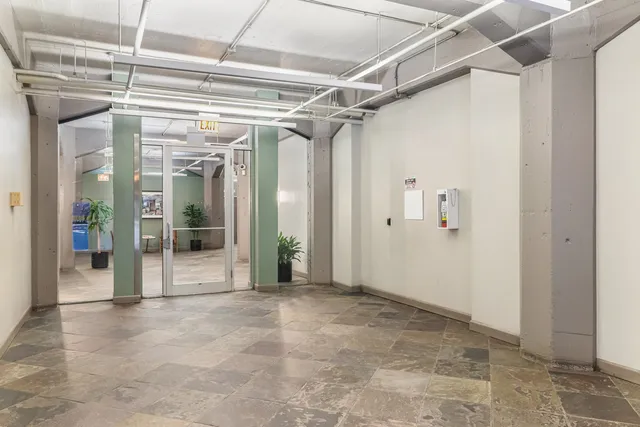 a view of gallery with glass door