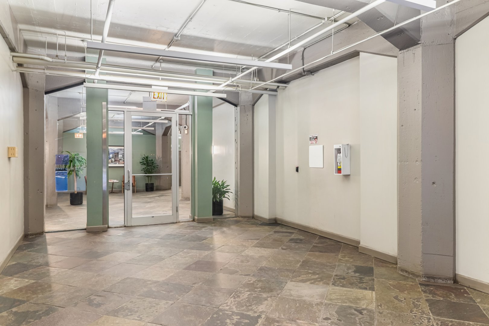 124 West Polk Street, Unit 100 Chicago, IL 60605 - Photo 30 of 45 a view of gallery with glass door