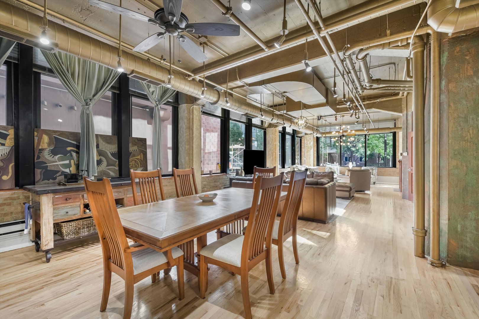 124 West Polk Street, Unit 100 Chicago, IL 60605 - Photo 9 of 45 a view of a dining room with furniture window and wooden floor