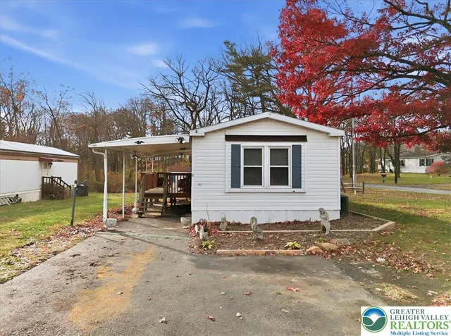 a house with trees in the background
