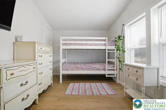 a bedroom with a bed and a table in it