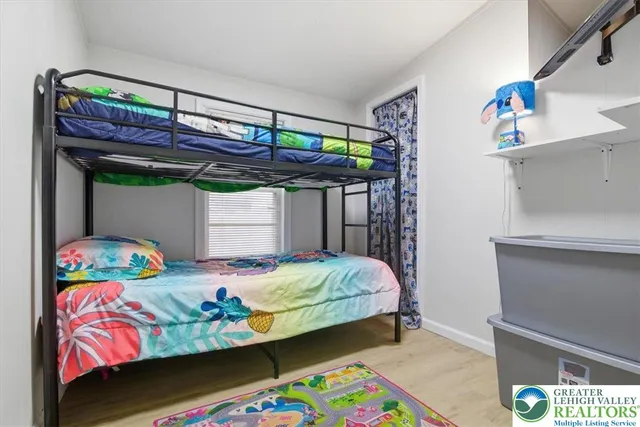 a bathroom with a sink a toilet and shower curtain