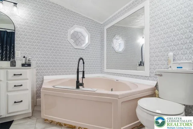 a bathroom with a toilet and shower