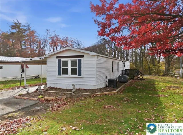 an aerial view of a house with a ocean view