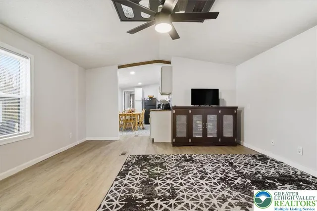 a living room with a couch and a window