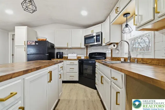 a kitchen with a sink and a stove