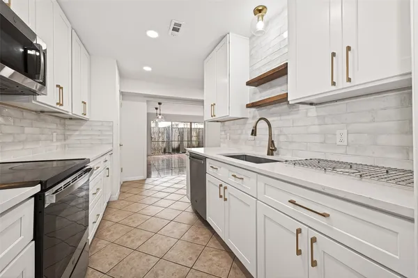 a kitchen with a sink and a window