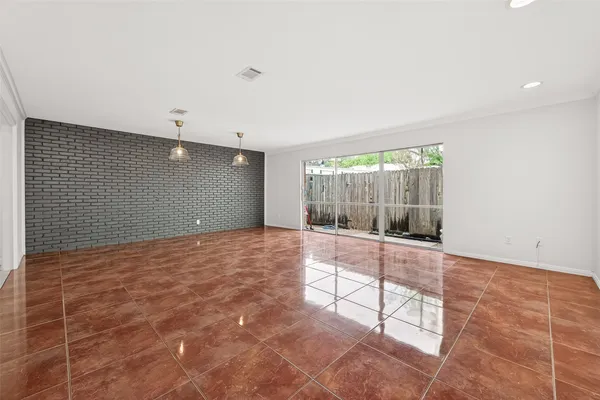 a large white kitchen with cabinets
