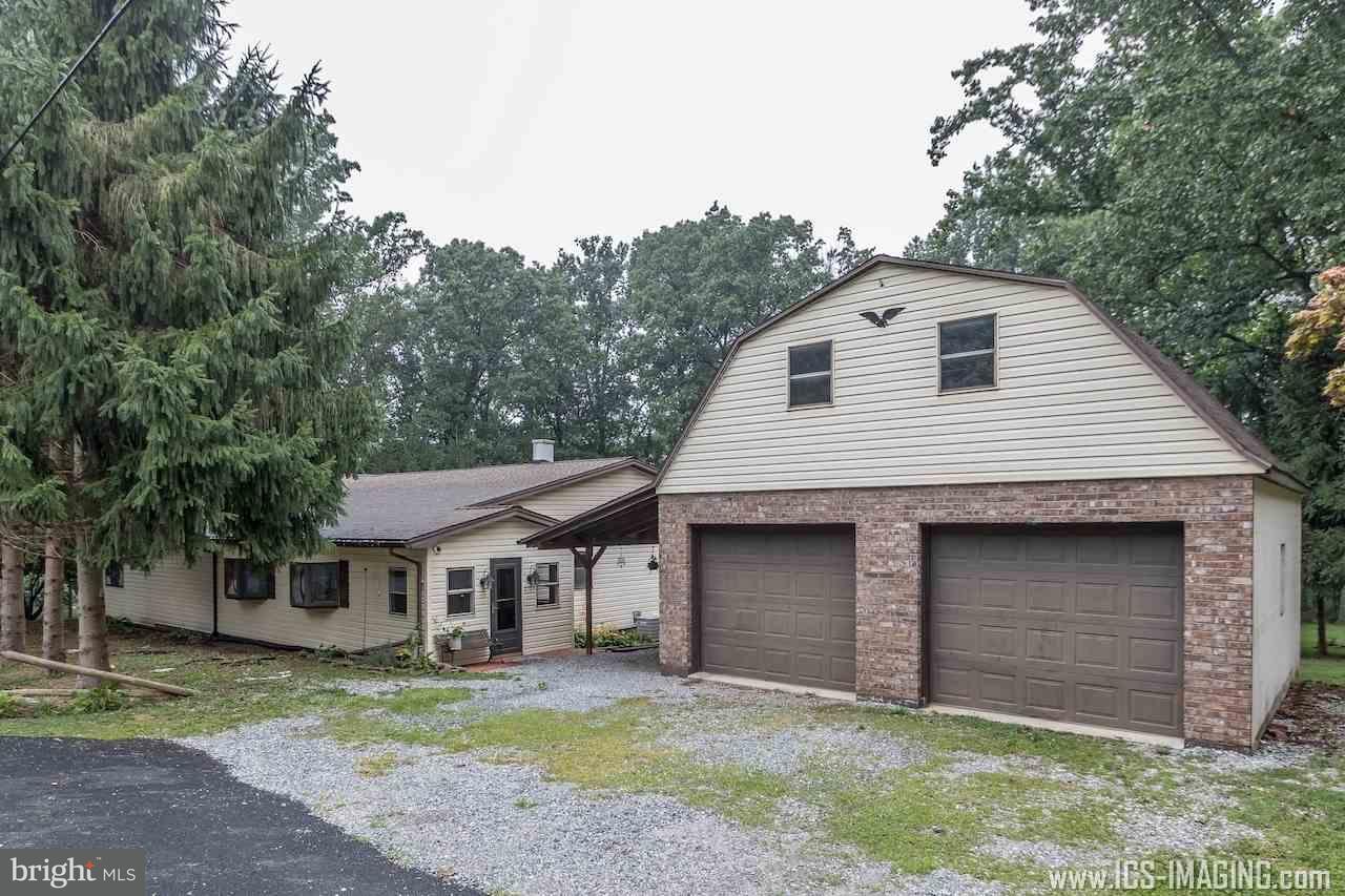 2105 Copenhaffer Road Dover, PA 17315 - Photo 1 of 36 a front view of a house with a yard and garage