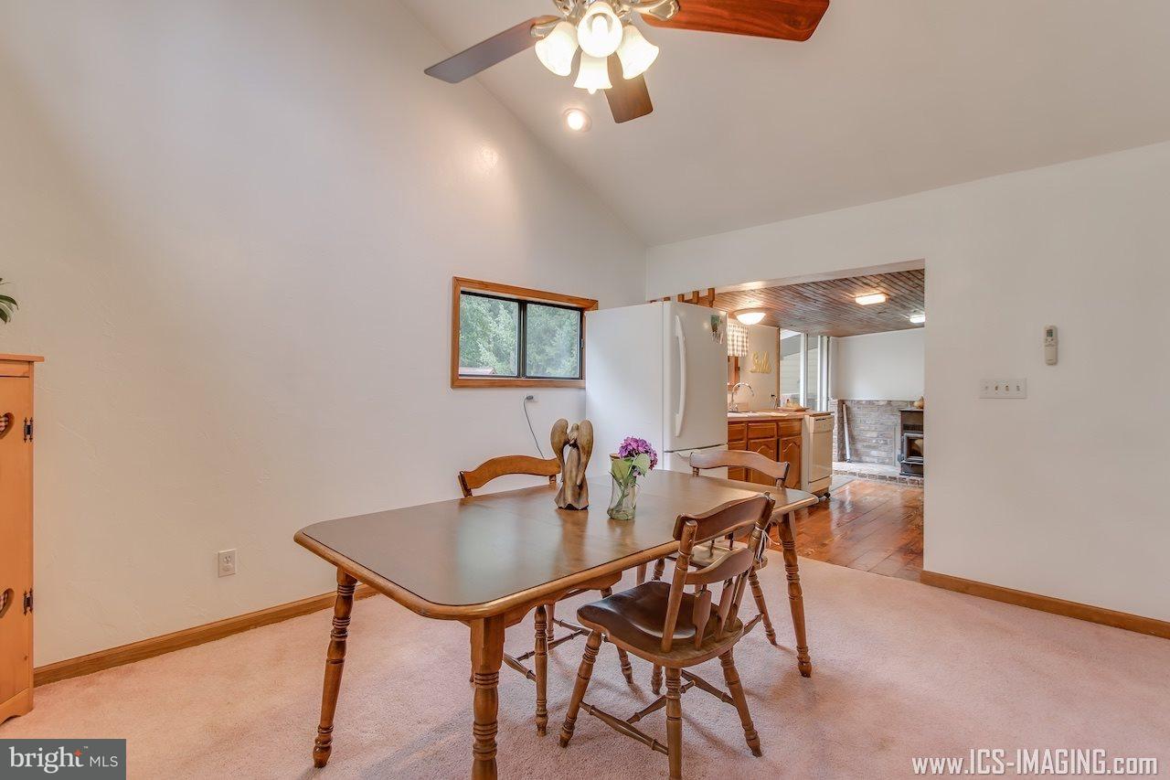 2105 Copenhaffer Road Dover, PA 17315 - Photo 14 of 36 a view of a dining room with furniture and a chandelier