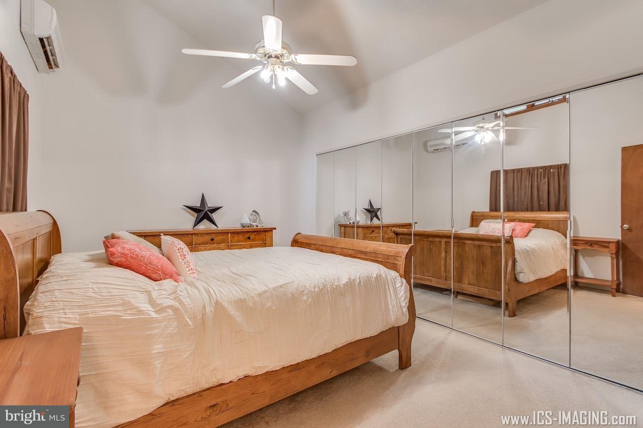 2105 Copenhaffer Road Dover, PA 17315 - Photo 23 of 36 a bedroom with bed and a chandelier