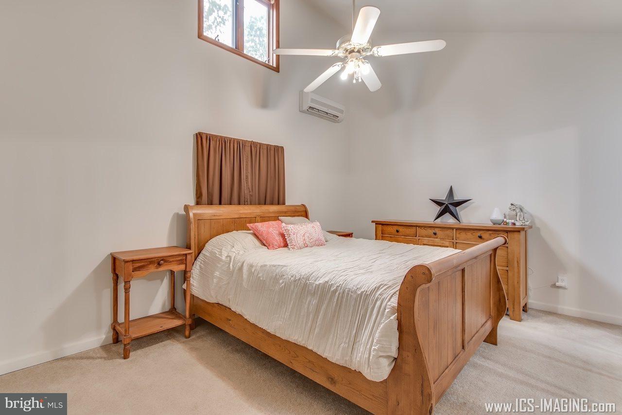 2105 Copenhaffer Road Dover, PA 17315 - Photo 24 of 36 a bedroom with a bed and a chandelier